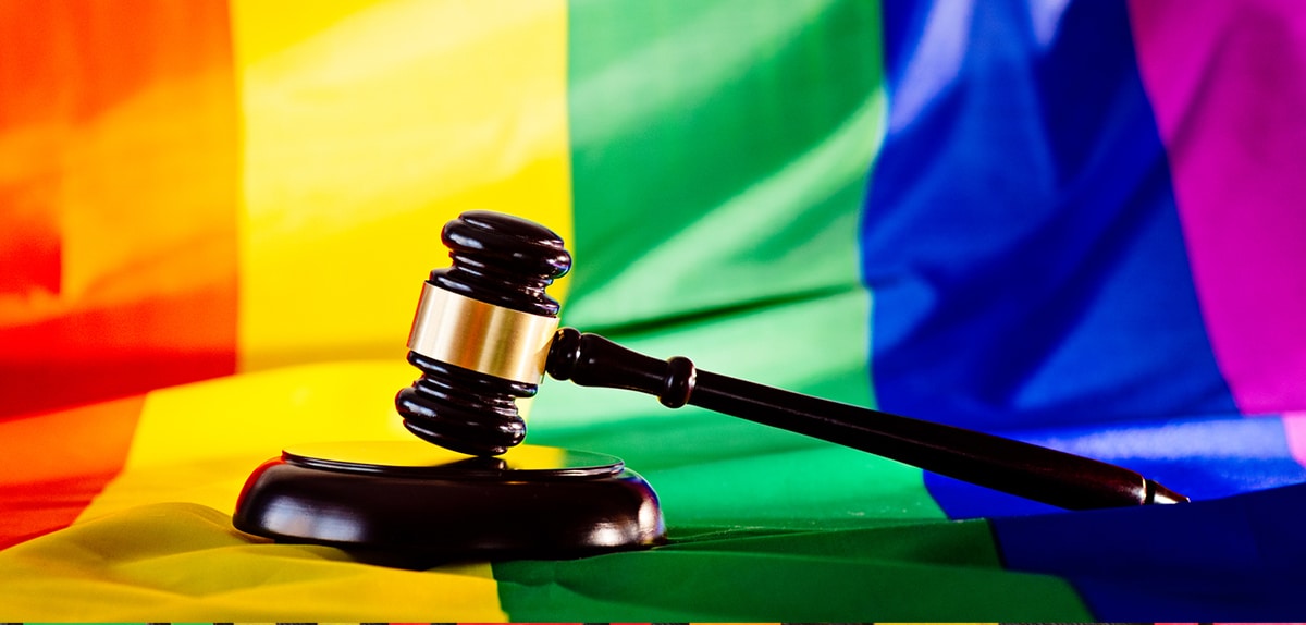 Woden judge mallet symbol of law and justice with lgbtq flag