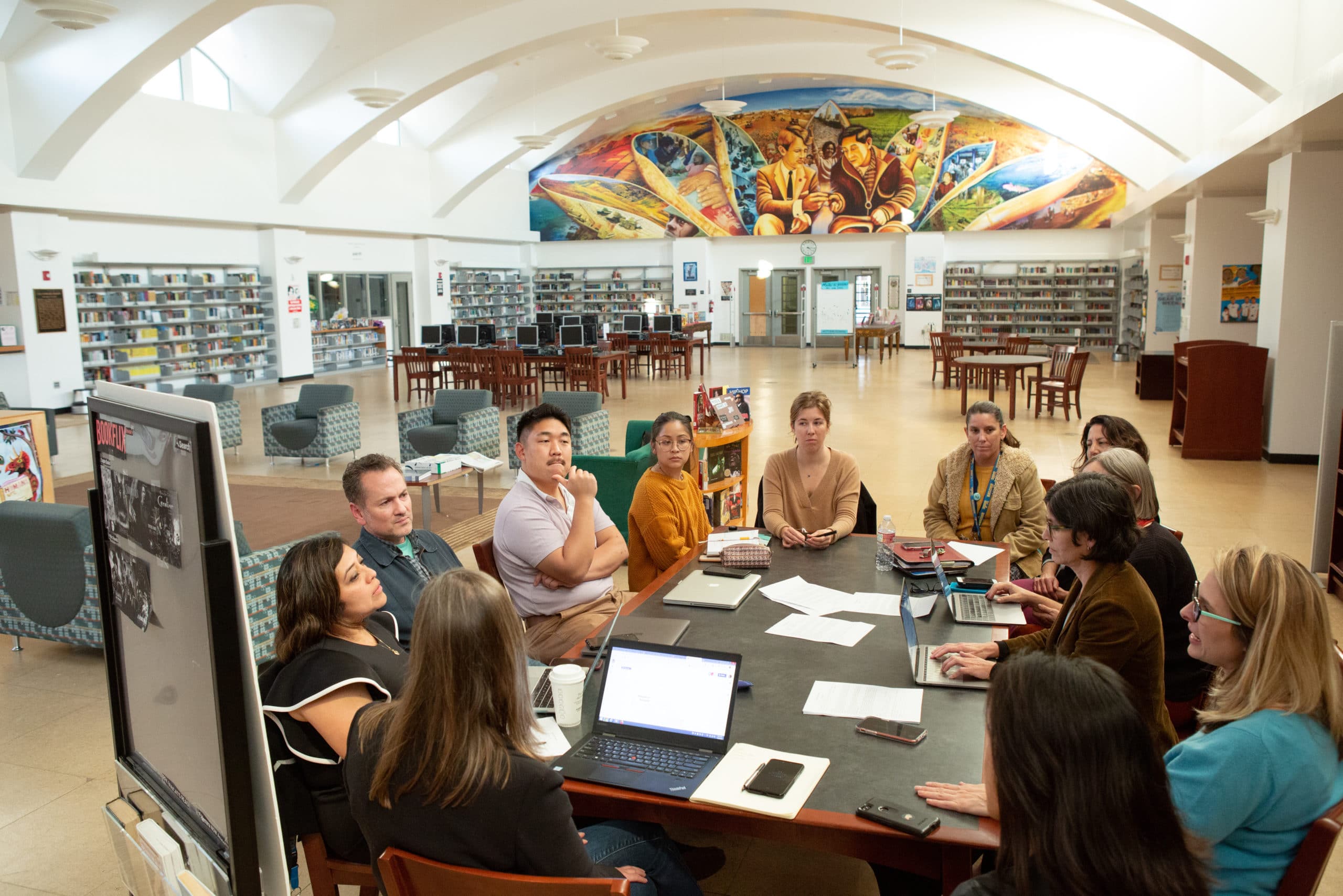 Teachers and staff from UCLA Community School meet with UCLA professors to discuss the various research projects happening at the school.