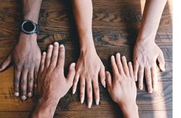 Diverse hands on table