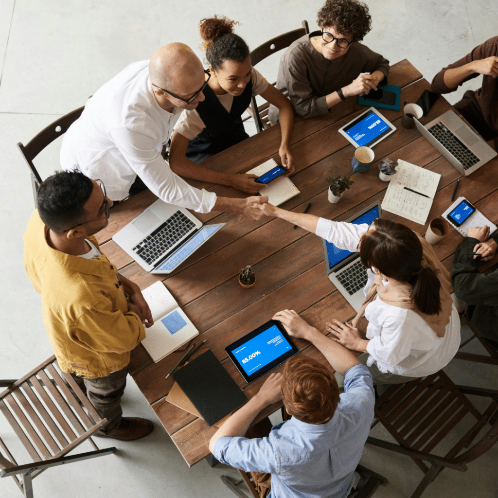 A group of people meeting around a table